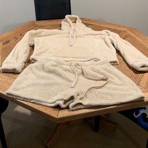 Cozy two piece set, top is a hoodie with long sleeves, bottoms are shorts